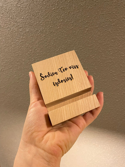 Telefona statīvs ar tekstu